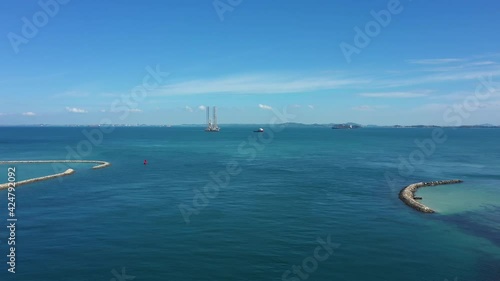 Drone shot of tug pulling oil rig, Singapore photo