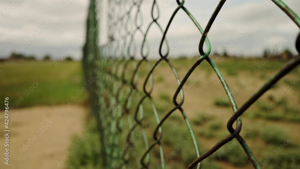 Border fence. Metal mesh separating countries. Protection from refugees. Prison net. Private territory. Closed area. Life in captivity. The escape. Border fence. Metal mesh separating countries. Protection from refugees. Prison net. Private territory. Closed area. Life in captivity. The escape.