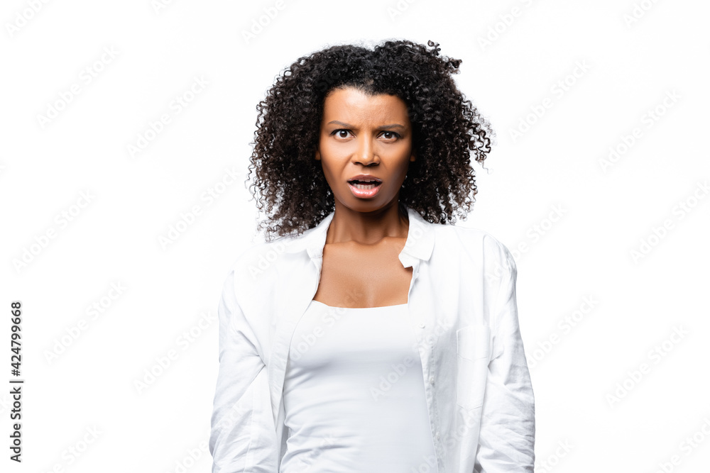 Confused african american woman looking at camera isolated on white Confused african american woman looking at camera isolated on white