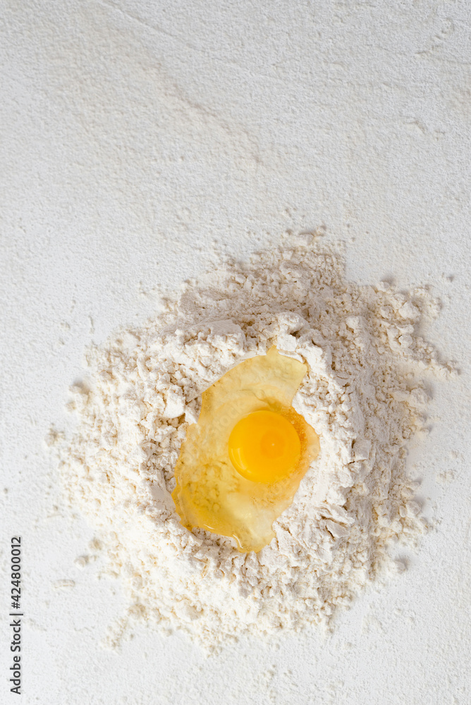 Raw chicken Organic Brown free range eggs Farm pack on white table Flour basket , egg yolk Raw chicken Organic Brown free range eggs Farm pack on white table Flour basket , egg yolk
