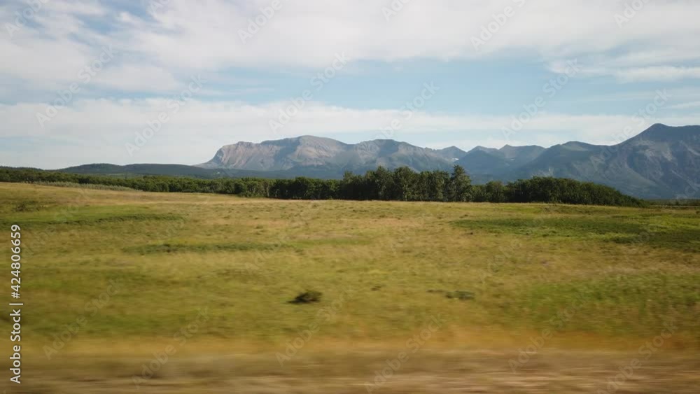WATERTON, AB - JULY 2019: Smooth & cinematic gimbal driving landscape of Waterton Lakes National Park