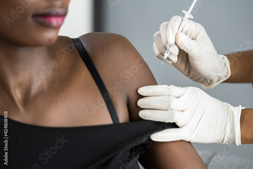 African American Nurse Making Covid-19 Vaccine Injection