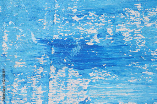 blue paint on a wooden wall