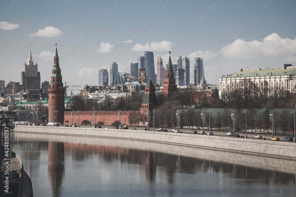 Beautiful Moscow Kremlin on the river bank. High towers. Sunny day. Ancient architecture. Center of Moscow. Beautiful Moscow Kremlin on the river bank. High towers. Sunny day. Ancient architecture. Center of Moscow.