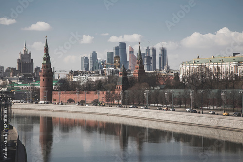 Beautiful Moscow Kremlin on the river bank. High towers. Sunny day. Ancient architecture. Center of Moscow.