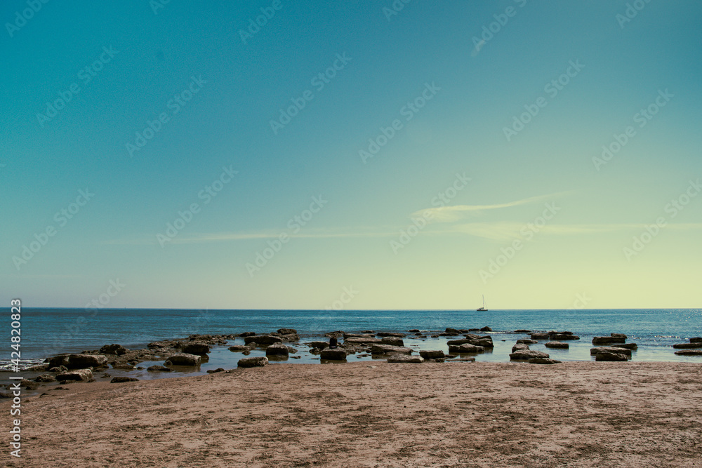 Sicily, April 2021 - Long shot of a beach in Sicily, sea rocks and good light