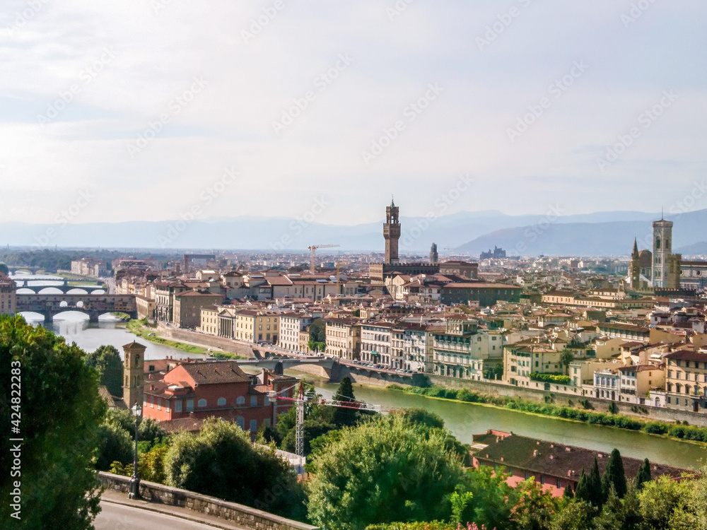 Panoramic cityscape of Florence on Arno river. Famous Basilicas, churches etc from Michelangelo terrace square point. Sunny summer day view