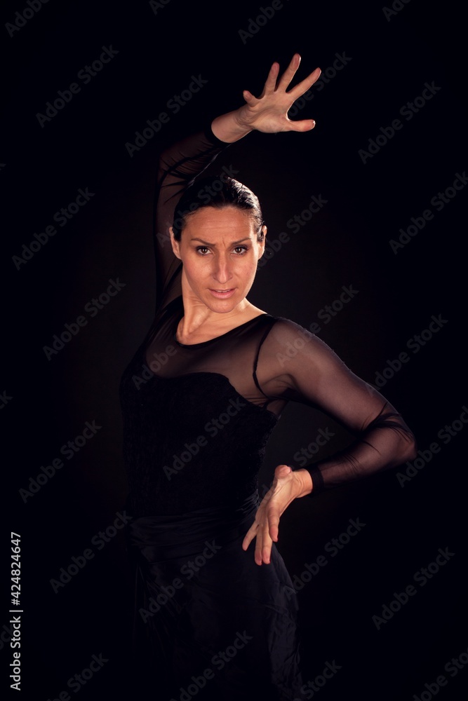 flamenco woman with black dress and sevillian hand