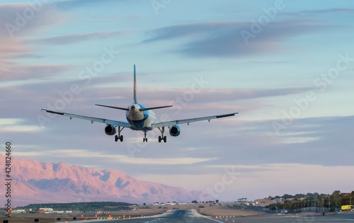 Landing airplane in airport of Eilat - famous tourist resort city in Israel
