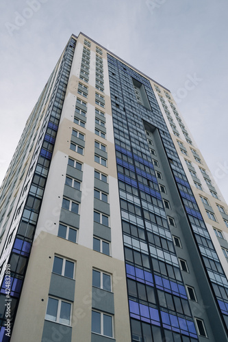 tall building goes off into sky windows