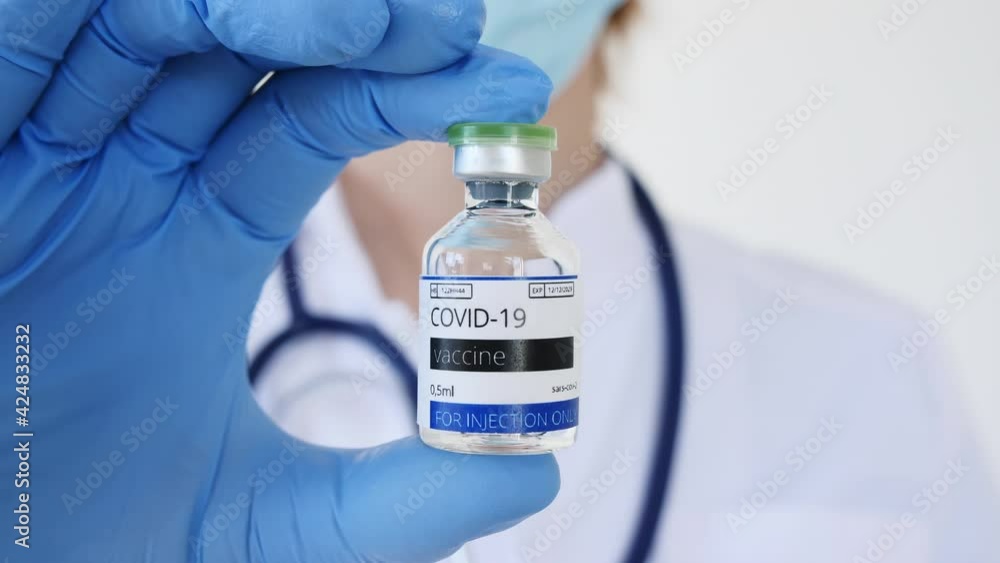 COVID-19 Vaccine in Researcher Hands, Doctor's Hand Holds a Vaccine Ampoule at the Hospital. New Medication Developing, Vaccination. Prevention of flu. High quality 4k footage COVID-19 Vaccine in Researcher Hands, Doctor's Hand Holds a Vaccine Ampoule at the Hospital. New Medication Developing, Vaccination. Prevention of flu. High quality 4k footage