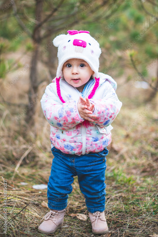 Portrait of little toddler girl having fun outdoors in cold weather at mountains Portrait of little toddler girl having fun outdoors in cold weather at mountains