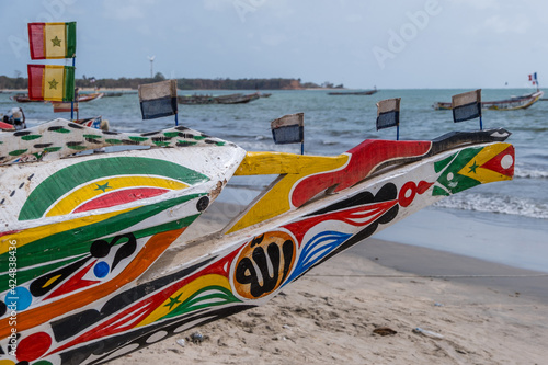 Proa decorada de una barca de pesca en las playas de Sanyang en la costa de Gambia photo