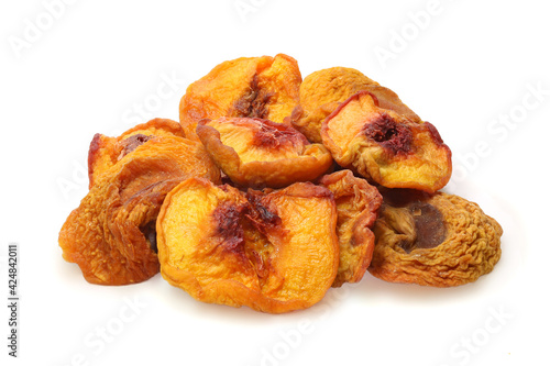 Pile of slices dried peaches isolated on white