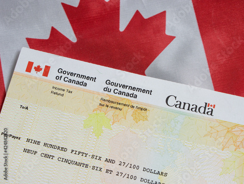 Canada Government Tax Refund Cheque, CRA Benefit with Canada Flag Background photo