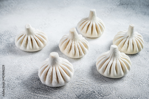 Georgian Raw dumpling Khinkali with meat. White background. Top view