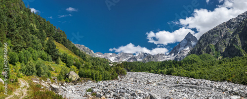 Summer panoramic view of the Adyl Su valley with Mt. Djan Tugan, North Caucasus, Kabardino-Balkaria, Russia. photo