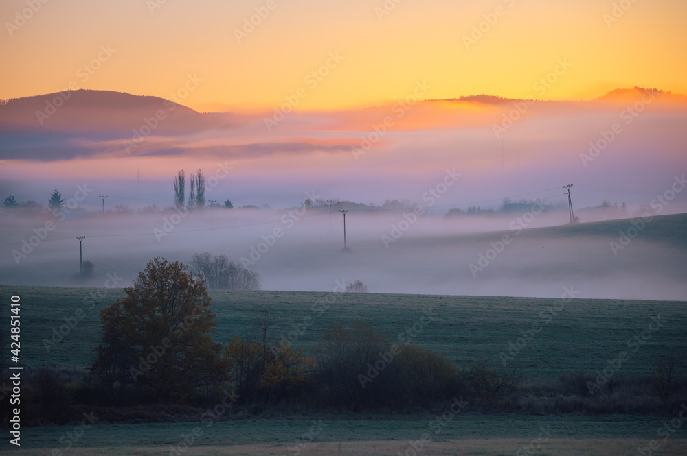 Fairy tale scenery, sunrise foggy autumn morning