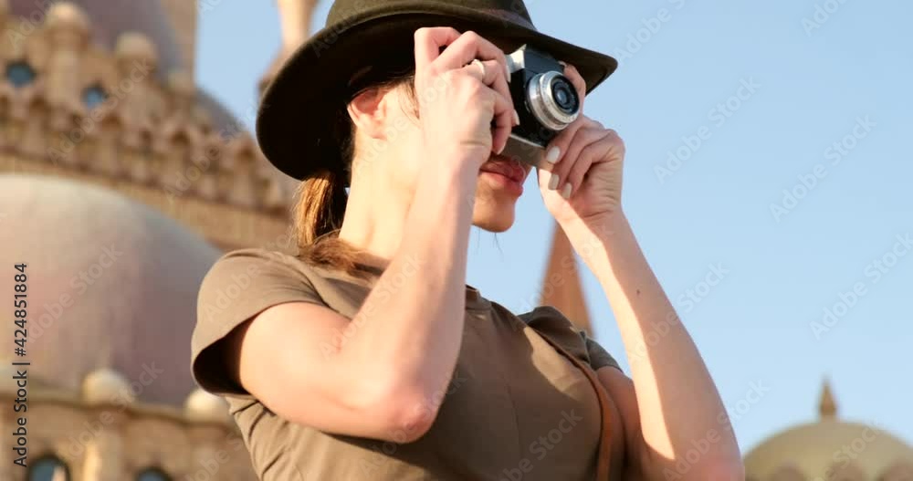 traveler in safari hat and shorts and desert boots with vintage camera The Mosque-Madrassa of Sultan Hassan and the Pyramids in the background,Cairo,Egyptconcept archeology,travel,religion, traveler in safari hat and shorts and desert boots with vintage camera The Mosque-Madrassa of Sultan Hassan and the Pyramids in the background,Cairo,Egyptconcept archeology,travel,religion,