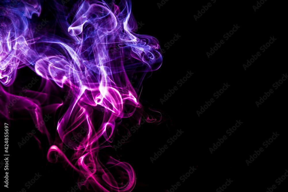 Obraz premium Colored smoke on black background