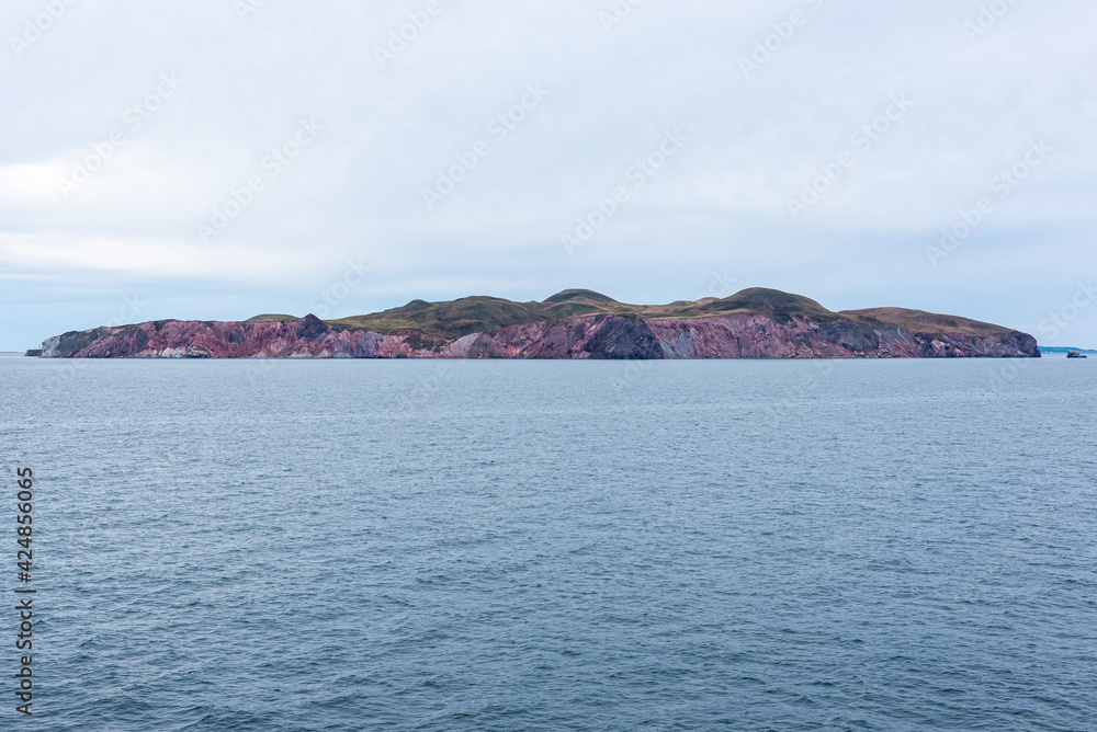 View of the Magdalen Islands (Iles-de-la-Madeleine) from the ferry boat between Souris (Prince Edward Islands) and Cap-aux-Meules (Quebec). View of the Magdalen Islands (Iles-de-la-Madeleine) from the ferry boat between Souris (Prince Edward Islands) and Cap-aux-Meules (Quebec).