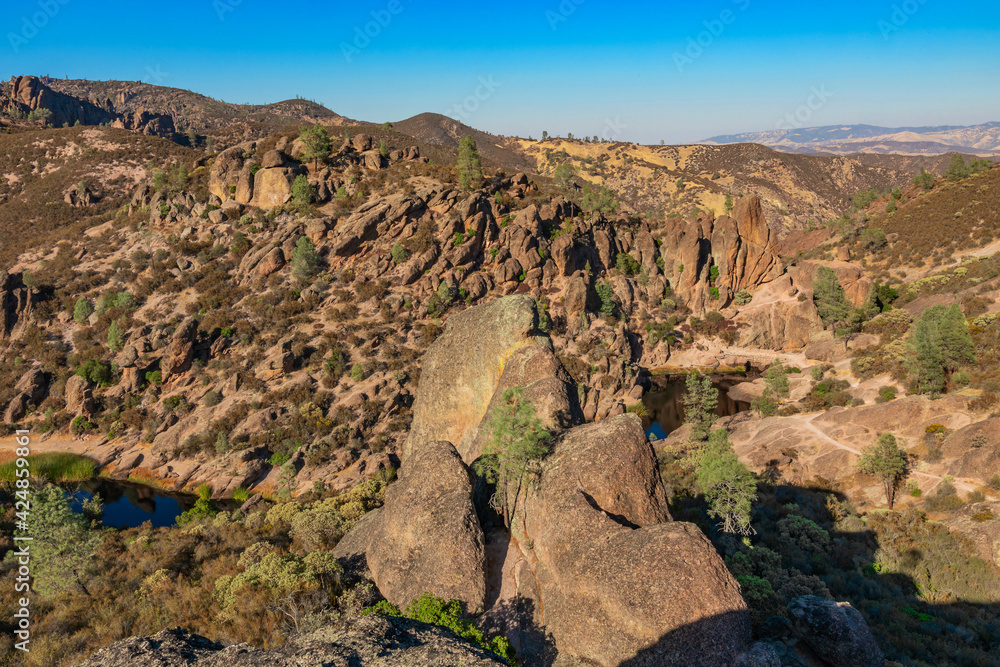 Rock formations in Pinnacles National Park in California, the destroyed remains of an extinct volcano on the San Andreas Fault. Beautiful landscapes, cozy hiking trails for tourists and travelers.
