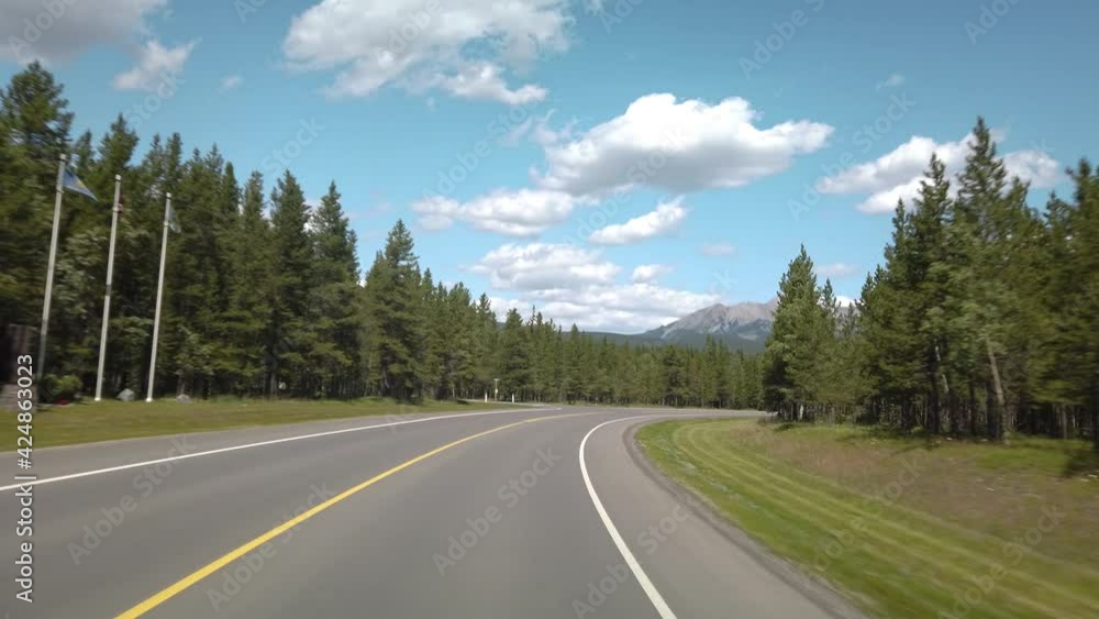Smooth Drive in Nature Through Kananaskis During Sunny Day Towards Banff Smooth Drive in Nature Through Kananaskis During Sunny Day Towards Banff