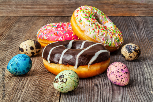 Colorful and delicious donuts and easter eggs