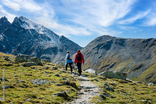 Two hikers on the Muragl valley in the area St.Moritz. Panoramic view. © ryszard filipowicz