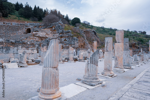 remnants columns of Memmius Monument built in memorial of Memmius in the 4th century A.D. in Ephesus ruins, historical ancient Roman archaeological sites in eastern Mediterranean Ionia region photo