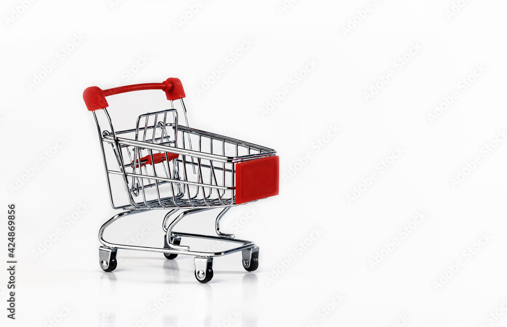 An empty supermarket cart with red inserts on a white background. An empty supermarket cart with red inserts on a white background.