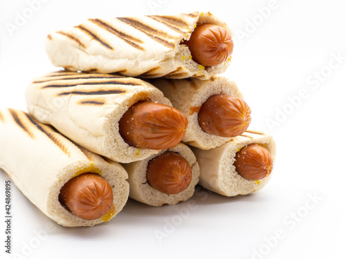 pile of french hot dogs on white background