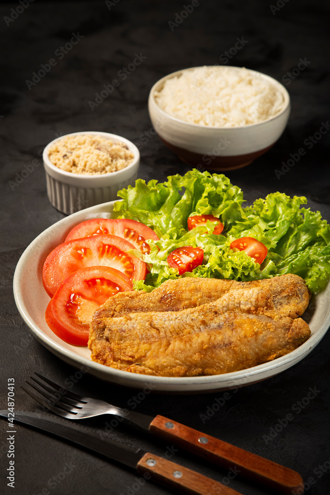 Fried fish with salad. Pexe Frito Brasileiro. Fried fish with salad. Pexe Frito Brasileiro.
