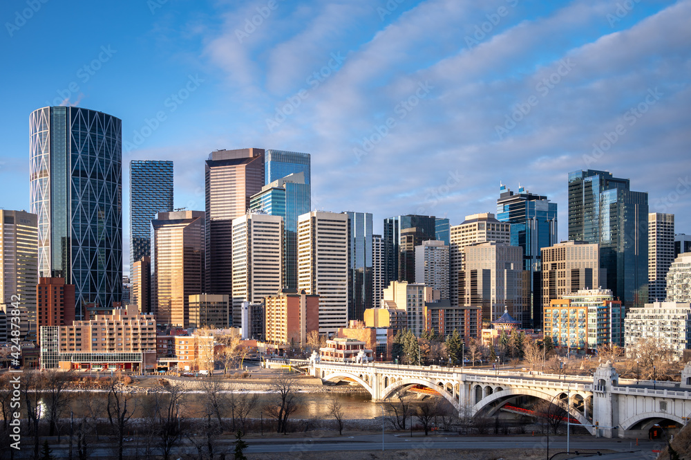 Calgary's skyline along the Bow River in the morning. 