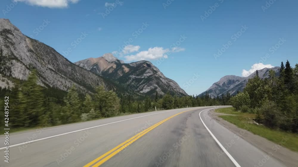 Smooth Drive in Nature Through Kananaskis During Sunny Day Towards Banff Smooth Drive in Nature Through Kananaskis During Sunny Day Towards Banff