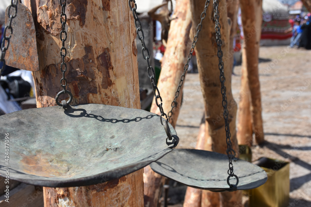 an old scale made of brass and copper an old scale made of brass and copper