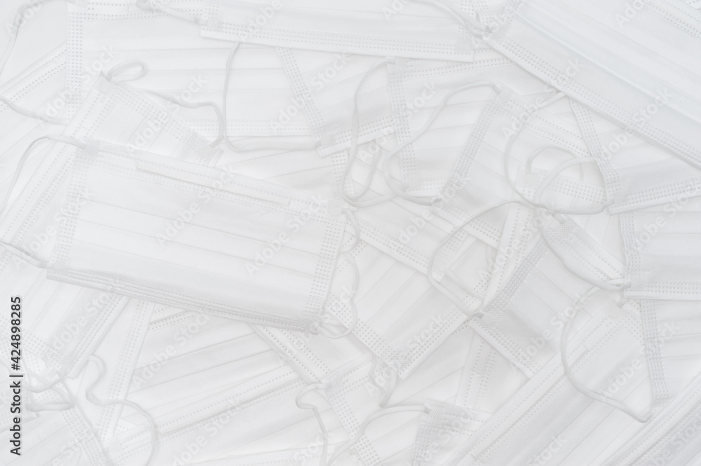 White surgical masks scattered. Top view White surgical masks scattered. Top view