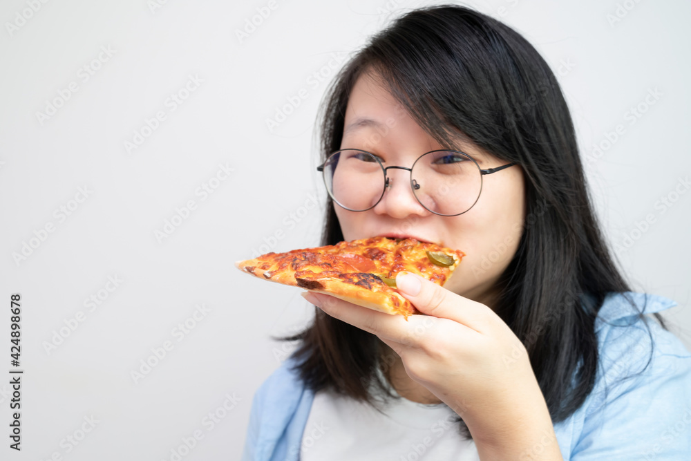 Happy glasses Asian young woman eat Pizza on white background. Happy glasses Asian young woman eat Pizza on white background.