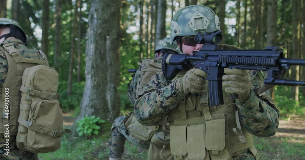 Soliders aiming assault rifle and protecting military base Soliders aiming assault rifle and protecting military base