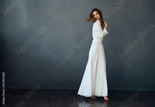 pretty woman and white dress glamor and luxury gray background model