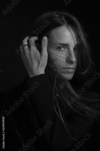 Black and white portrait of a young girl with long hair