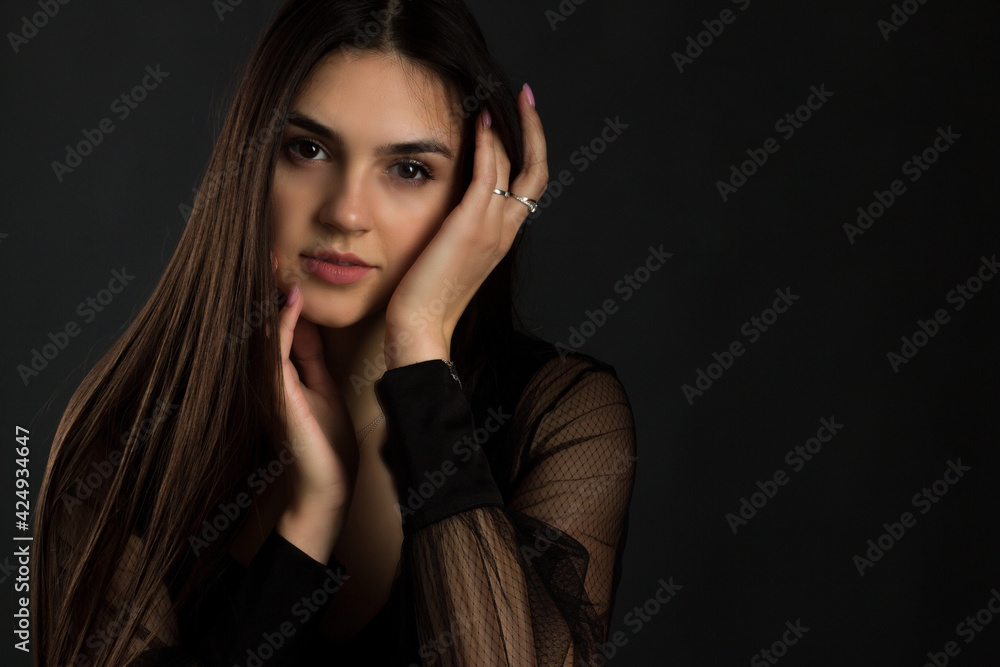 portrait of a young woman with long brown hair. portrait of a young woman with long brown hair.