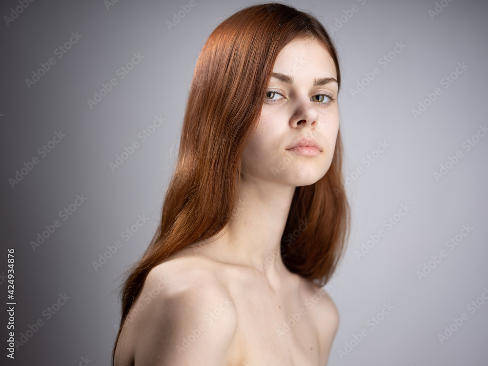 portrait of a woman red hair naked shoulders side view portrait of a woman red hair naked shoulders side view