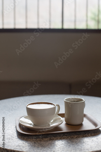 Fototapeta Naklejka Na Ścianę i Meble -  Cappuccino or latte coffee with heart shape in cafe.