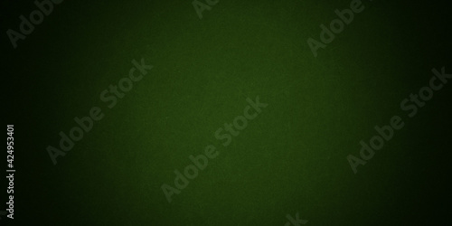 Elegant dark emerald green background with black shadow border and old vintage grunge texture design © gojalia