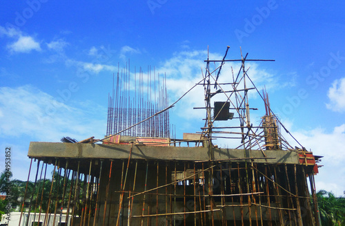 Building construction site against blue sky