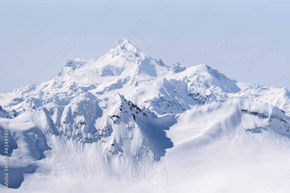 Obraz premium Snow covered Greater Caucasus mountains at winter sunny day. View from Elbrus slope, Kabardino-Balkaria, Russia