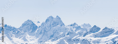Fototapeta Naklejka Na Ścianę i Meble -  Panoramic view of a snowy winter Greater Caucasus mountains at sunny day. Mt. Elbrus, Kabardino-Balkaria, Russia