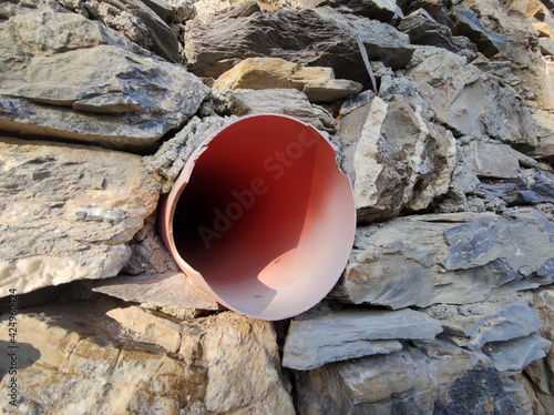 medieval wall of alley of Sant Ilario Genoa Italy with new water pipe photo