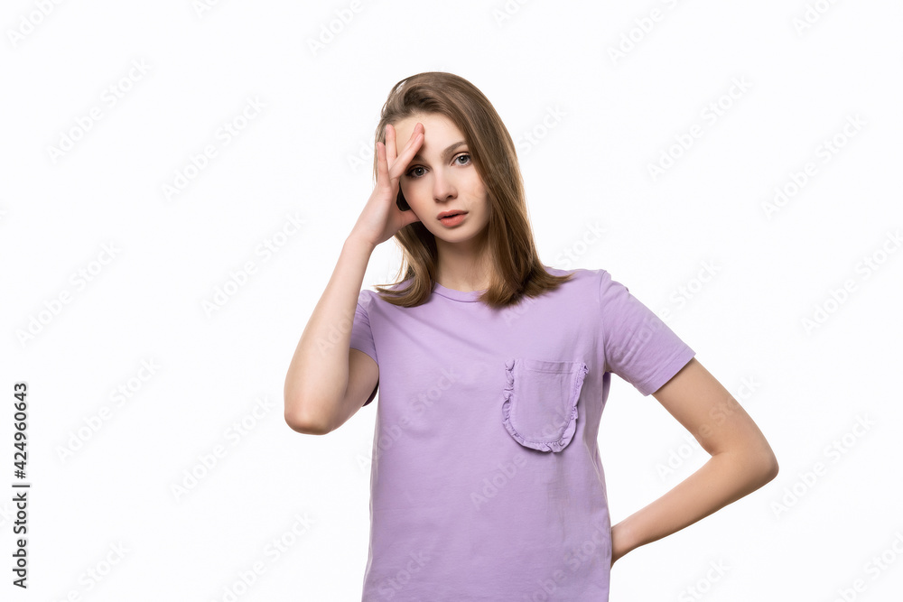 Regretful young woman made mistake. Studio shot, white background. Human emotions, facial expression concept Regretful young woman made mistake. Studio shot, white background. Human emotions, facial expression concept